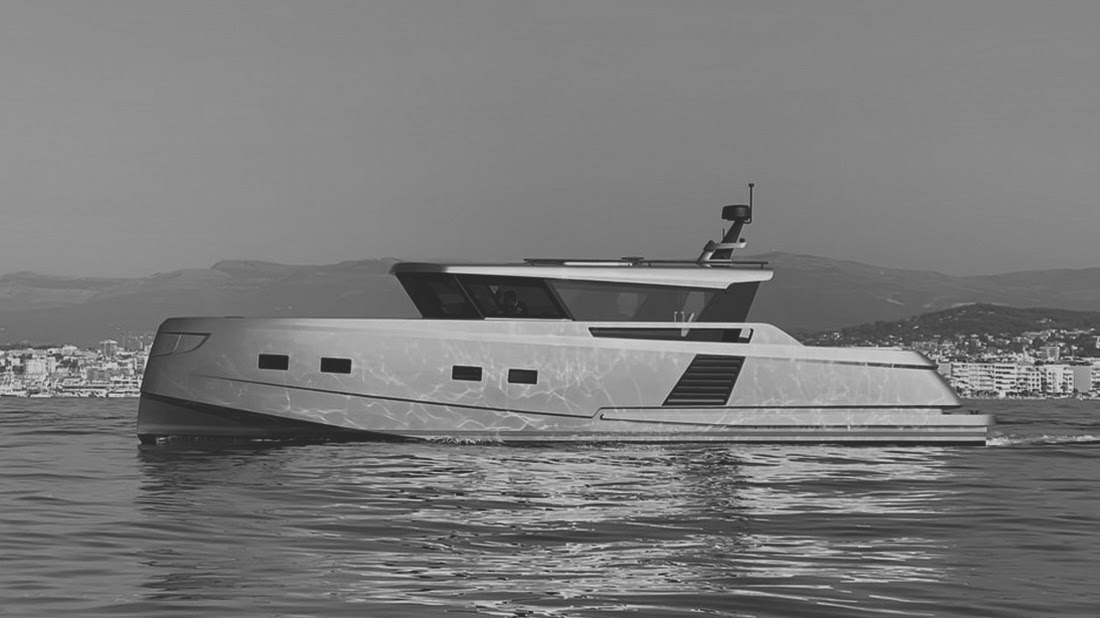 Motor yacht cruising near a Mediterranean coastline